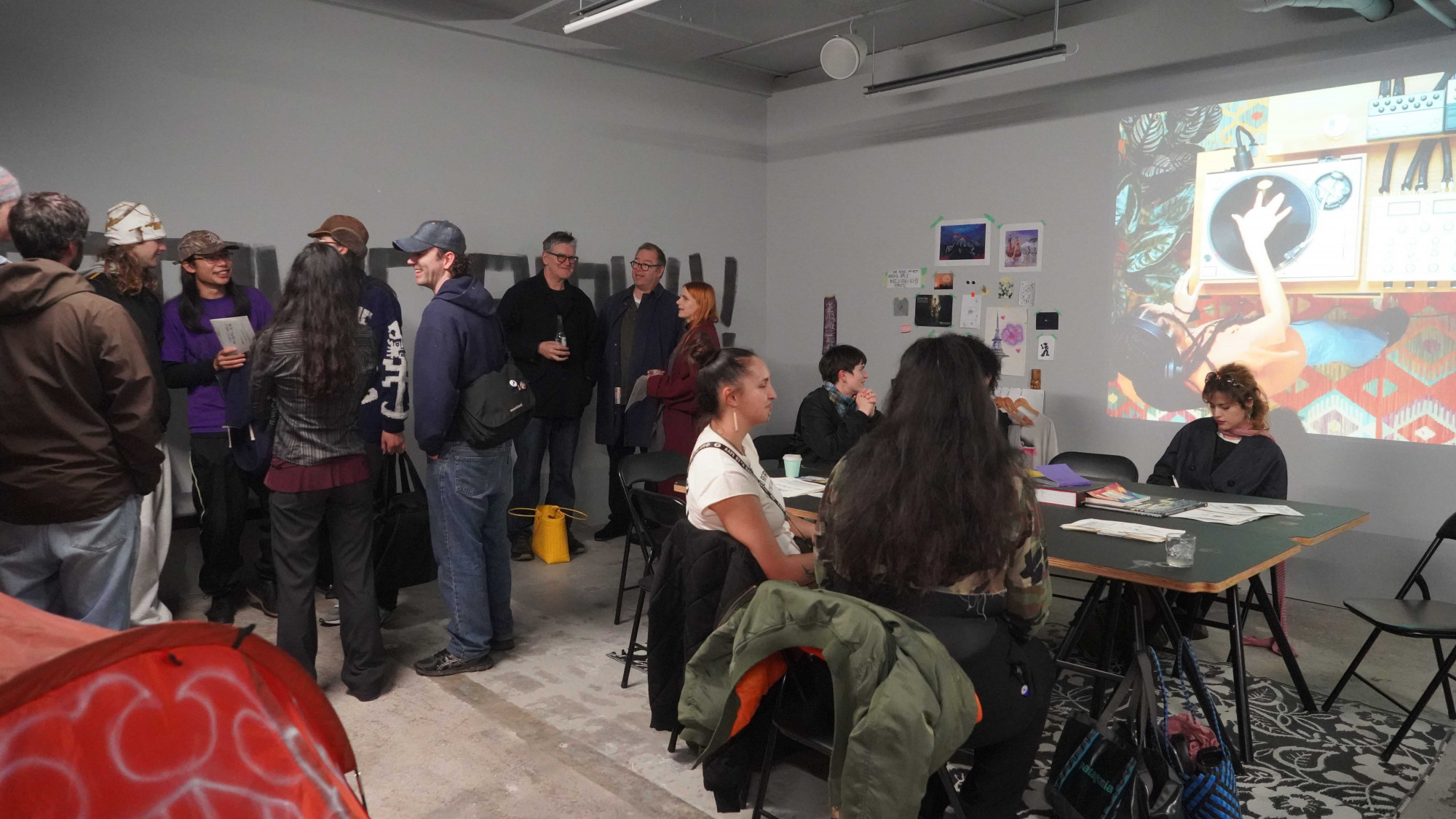 A group of people talking to each other.